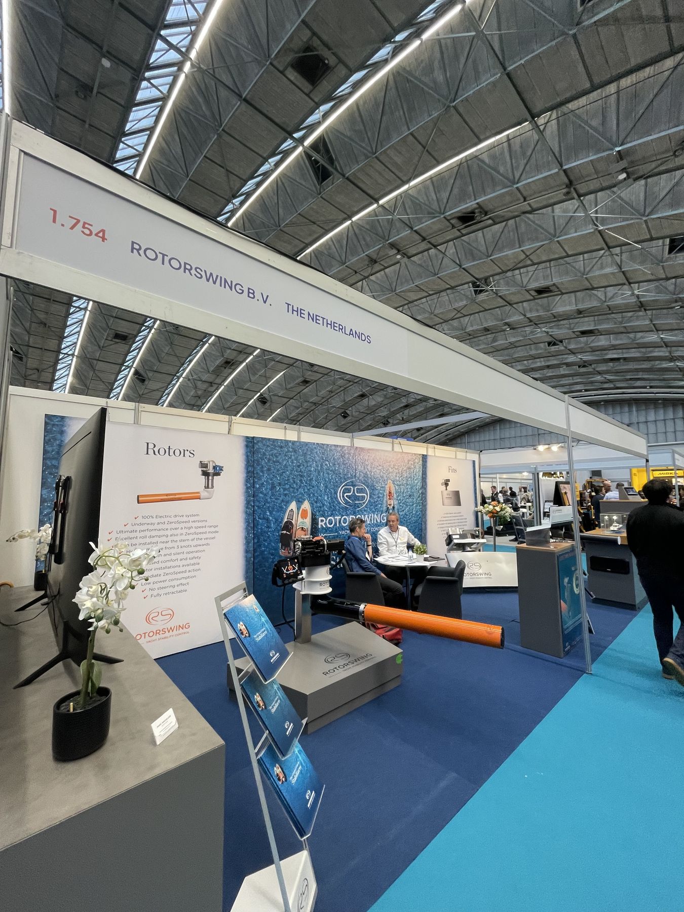 The RotorSwing stand at METSTRADE in the RAI Amsterdam, a rotor and a fin laid out on the counter under the company name